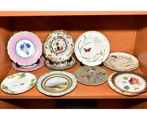 A COLLECTION OF LATE 19TH AND 20TH CENTURY POTTERY AND PORCELAIN DESSERT PLATES, including a Mintons plate painted to the cen