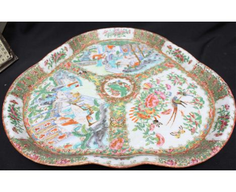 A late 19th century Canton enamel porcelain tray of trefoil design, decorated in polychrome enamels with figures and exotic b