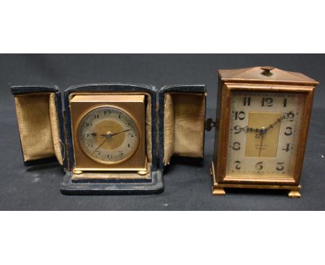 A Zenith 8-Day travelling alarm clock, in lacquered brass case, Arabic numerals, together with another smaller lacquered bras