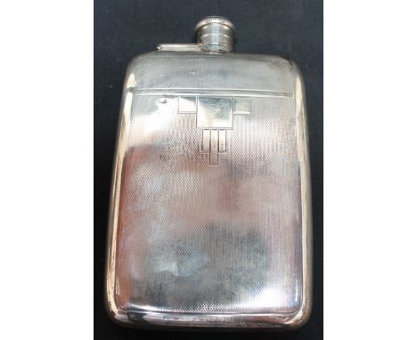 A George V Art Deco style silver hip flask, hallmarked London 1935, by Mappin & Webb, with engine turned decoration. 4.85 ozt