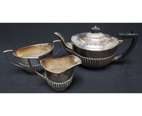 A silver plated three piece tea set with ebony handle.