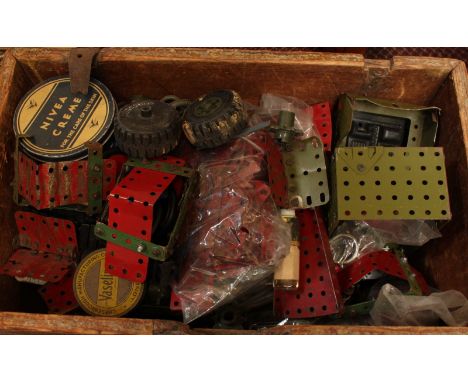 A collection of Meccano tin plate, including Army vehicles with instructions.