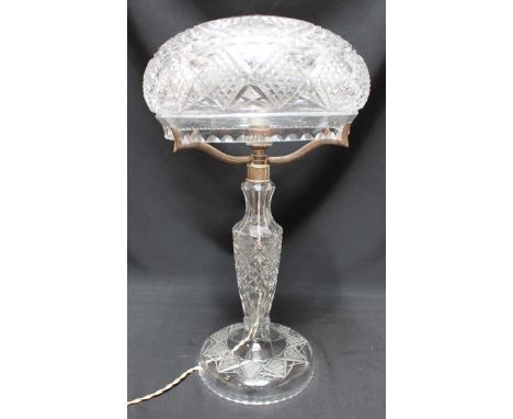 A cut-glass table lamp with mushroom shade, baluster stem and circular base, 43cm high