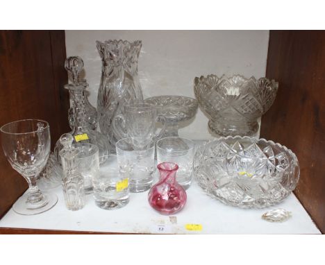 SECTION 13. A shelf of assorted cut crystal and glassware including a heavy cut stemmed fruit bowl, another fruit bowl and va