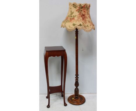 A large mahogany torchere stand supported on cabriole legs, together with an oak standard lamp. (2)