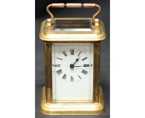 A French carriage clock with eight-day movement in glazed gilt metal case.