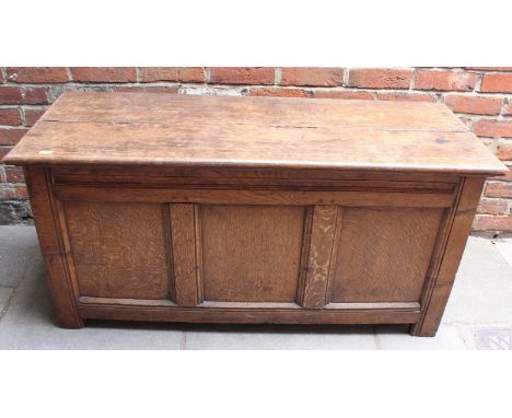 An 18th century oak coffer of frame-and-panel construction, three plain panels, moulded rails and stiles, 127cm wide.  