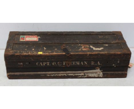 An early 20th century metal bound and lead lined wooden travelling trunk, named Captain O.G. Freeman R.A. and with Cunard Lin