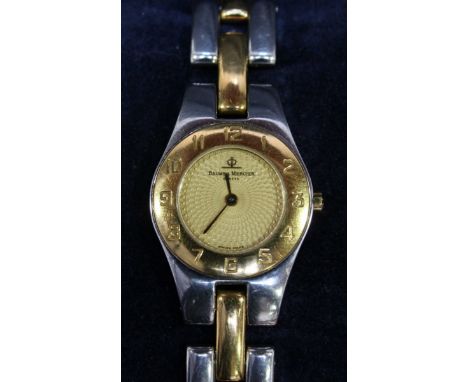 A ladies Baume & Mercier bi-metal cocktail watch, number 4100750, with gilded engine turned dial, numerals to the bezel and t