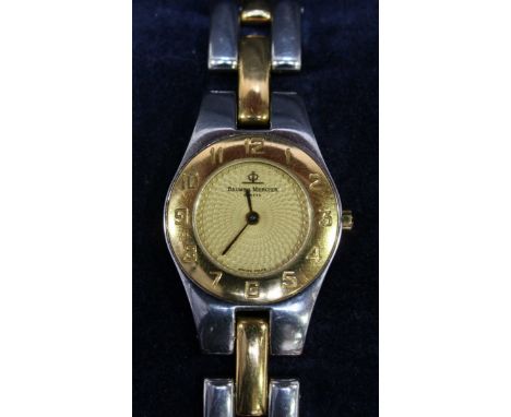 A ladies Baume & Mercier bi-metal cocktail watch, number 4100750, with gilded engine turned dial, numerals to the bezel and t