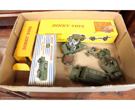 A boxed Dinky Toys 692 Medium Gun, 689 Medium Artillery Tractor, 697 25-pounder Field Gun Set, and several unboxed military v