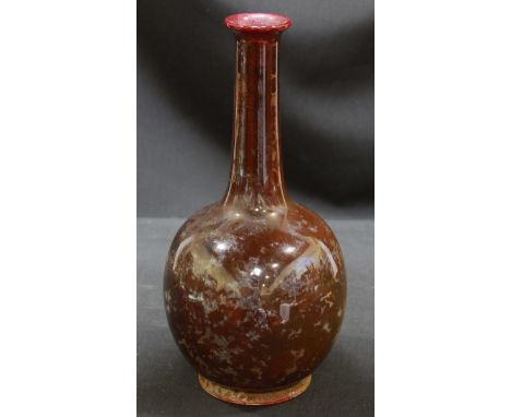 An Arthur Wilkinson high fired lustre bottle vase, circa 1907, with bulbous body and slender neck, printed mark to the base.