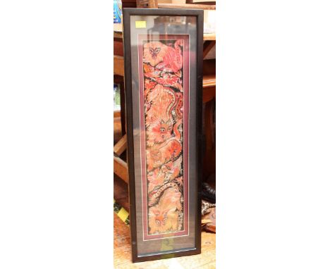 A Chinese silkwork panel embroidered with Dogs of Fo, framed. 66 x 13 cm