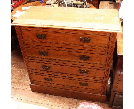 An Edwardian light oak chest of four long drawers, 99cm wide 
