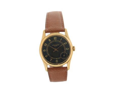 Patek Philippe,”Geneve”, movement No. 1962995, case No. 2992987, Ref. 5000, 18K yellow gold, self-winding, wristwatch with an