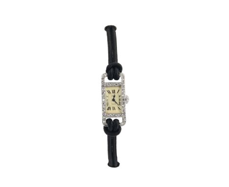 Cartier, "France", 18K white gold, "Art Deco", wristwatch with diamonds. Made in the 1920's. The rectangular case decorated w