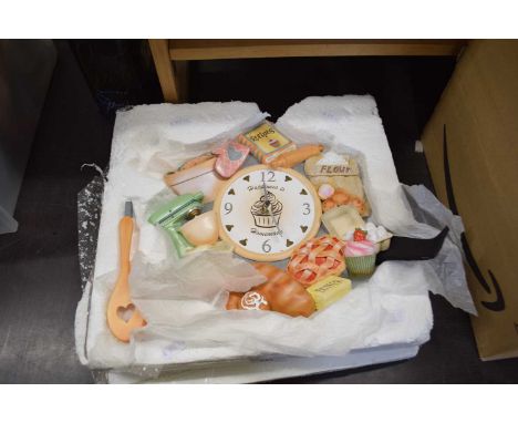 Novelty ceramic clock with border of flour, sugar, butter etc