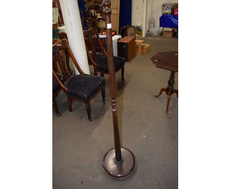 A turned wooden standard lamp