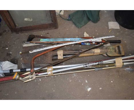 Quantity of assorted garden tools to include spades, hoes, saws etc