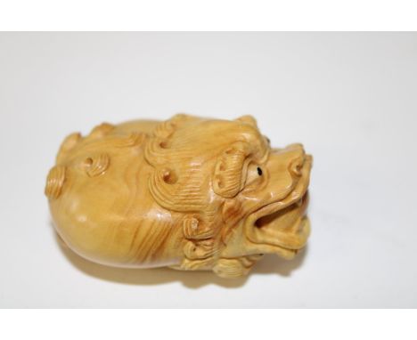 A carved boxwood netsuke 