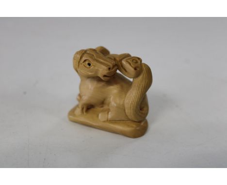 A Chinese box wood netsuke 
