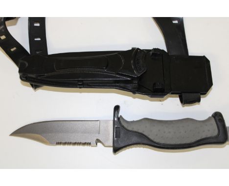 A titanium divers knife in sheath 