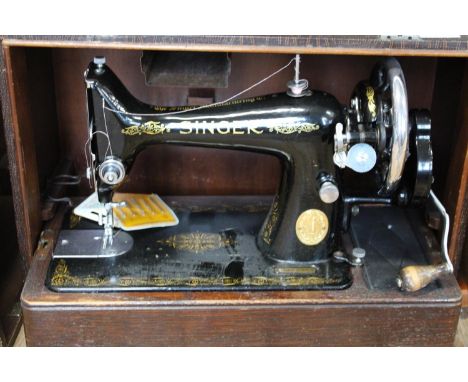 A cased Singer manual sewing machine Collection Only 