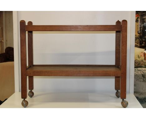 An original Robert (mouseman) Thompson 1950's early 1960's oak tea trolley, with trademark carved mouse on one corner. 86cm x