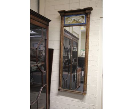 A Regency carved wood and gilt gesso Trumeau type wall mirror, with split reeded pilasters and a reverse painted glass frieze