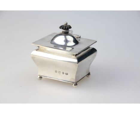 A Victorian silver tea caddy, of bombé form, the hinged cover with ebonised finial on four ball feet, by George Nathan and Ri