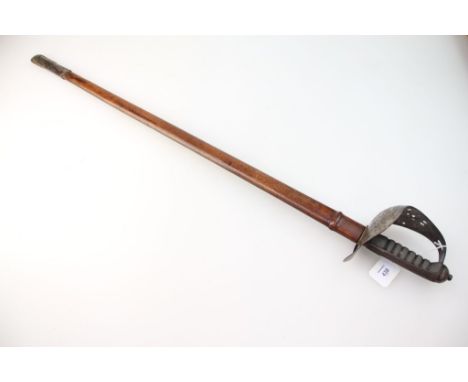 An 1895 pattern infantry officer's sword and scabbard, with engraved blade and ray skin grip, 82 cm (32 1/4 in) long