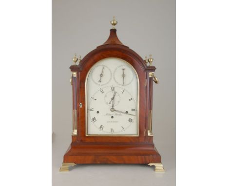 Robert Wood, London. A George III mahogany and gilt metal cased musical bracket clock, the arched cased with urn finials over