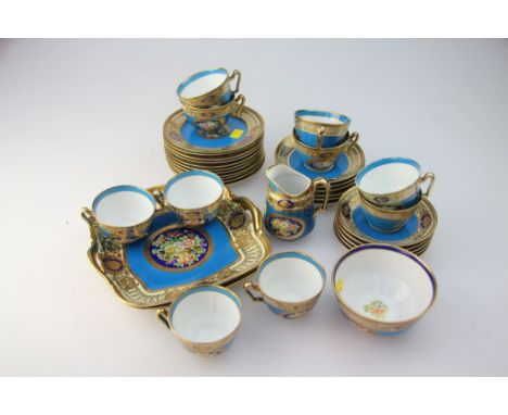 A Noritake tea service, comprising two twin handled cake plates, ten cups, eleven saucers, eleven tea plates, cream and sugar