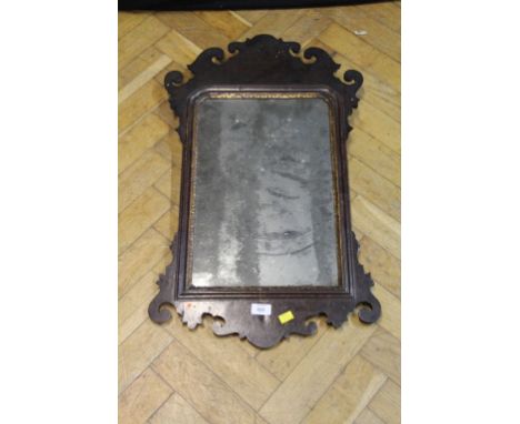 A late 18th century walnut fret frame wall mirror, with giltwood slip and period glass, 75.5 x 45 cm