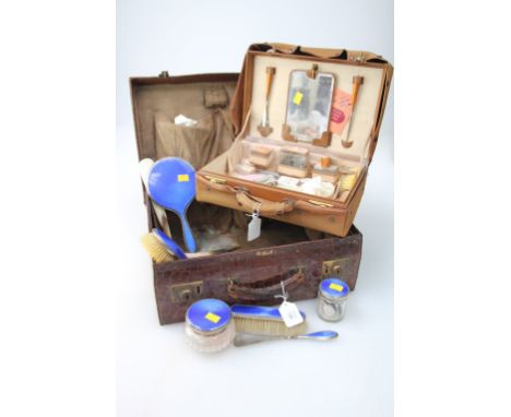 An eight piece silver and blue guilloché enamel dressing table set, comprising two dressing table jars, a hand mirror, two ha