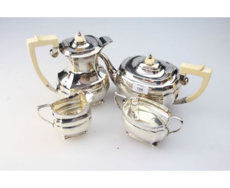 An early 20th century  matched silver four piece tea service, of stepped oval form, comprising tea and hot water pots, each w