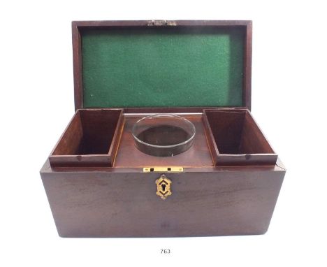 A Victorian mahogany tea caddy with brass handle, fitted two interior boxes and a glass mixing bowl, 35cm wide 