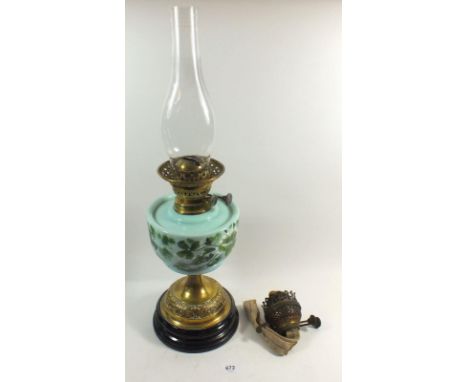 A Victorian oil lamp with painted reservoir and brass base, plus extra burner 