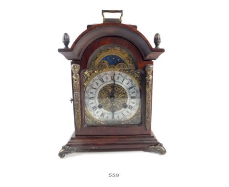 A German striking walnut mantel clock by Franz Hermle with key, 30cm tall 