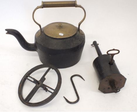 A cast iron kettle and bottle jack with key