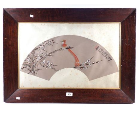 A Chinese fan shaped watercolour painting on silk depicting a bird on a blossom tree, framed and glazed, 61.5 x 39cm 