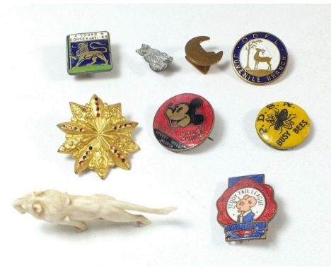 A group of vintage enamel badges including Meccano, Mickey Mouse and Teddy Tail League etc.