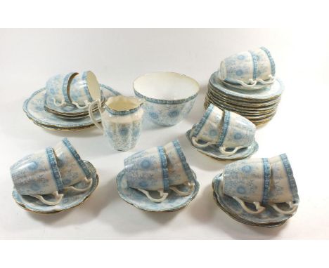 A Wileman &amp; Co Victorian tea service comprising: twelve cups and saucers, twelve tea plates, two cake plates, milk and su