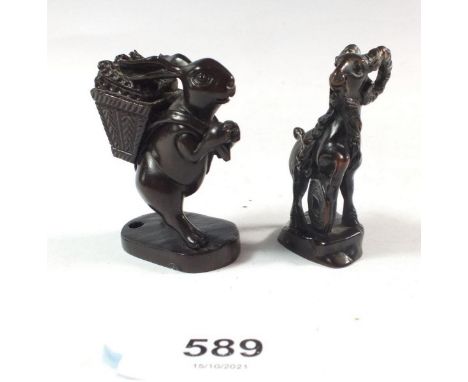 Two Japanese carved wood netsuke of a rabbit and a goat 