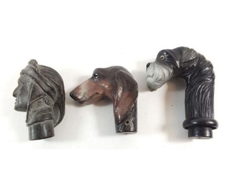 Two contemporary walking stick handles in the form of a dogs head and a vintage bronze one cast as a Roman head 