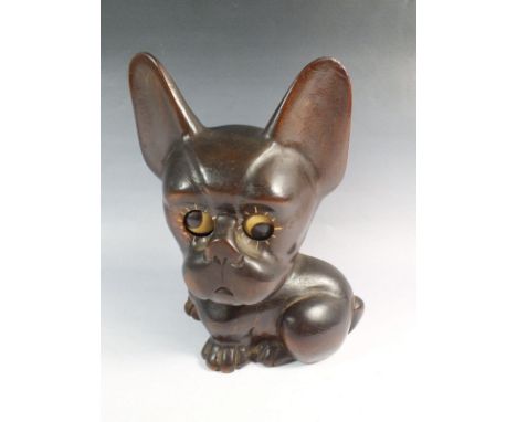 A novelty Art Deco carved wood dog clock with rolling eyes which indicate the time, collar a/f