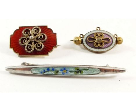 A Norwegian silver and enamel brooch and two other enamel brooches 