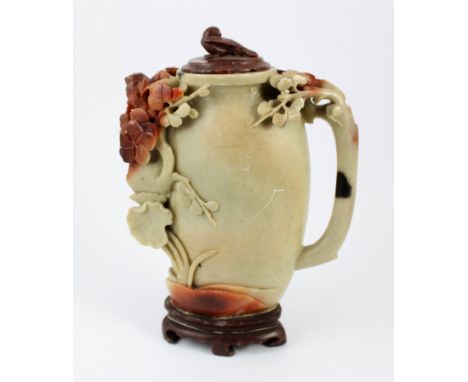 A Chinese carved soapstone or hardstone water pot with floral decoration and carved bird finial, 16.5cm