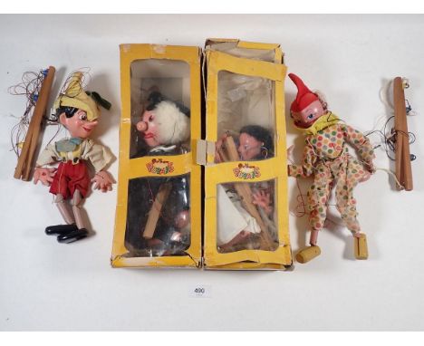 Two Pelham puppets boxed and a clown and Pinocchio puppet - not boxed 