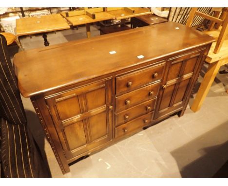 Ercol sideboard, twin end cupboards and four central drawers, L: 150 cm